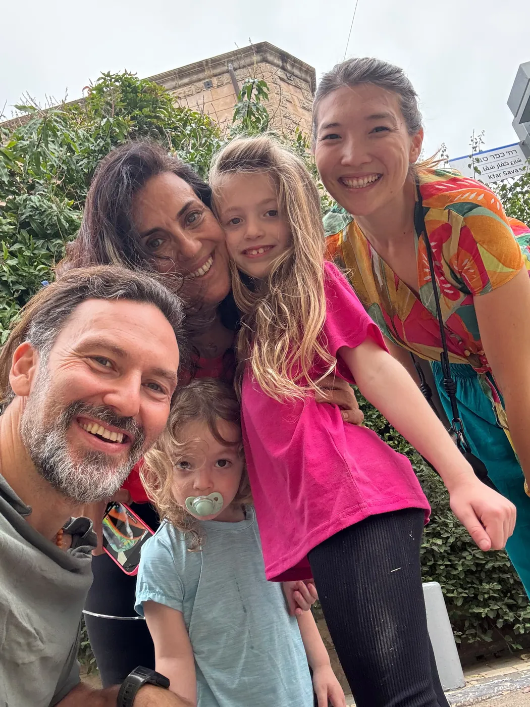 Liran Jakob Rosenfeld with his children, their mother and Laura on a street in Israel