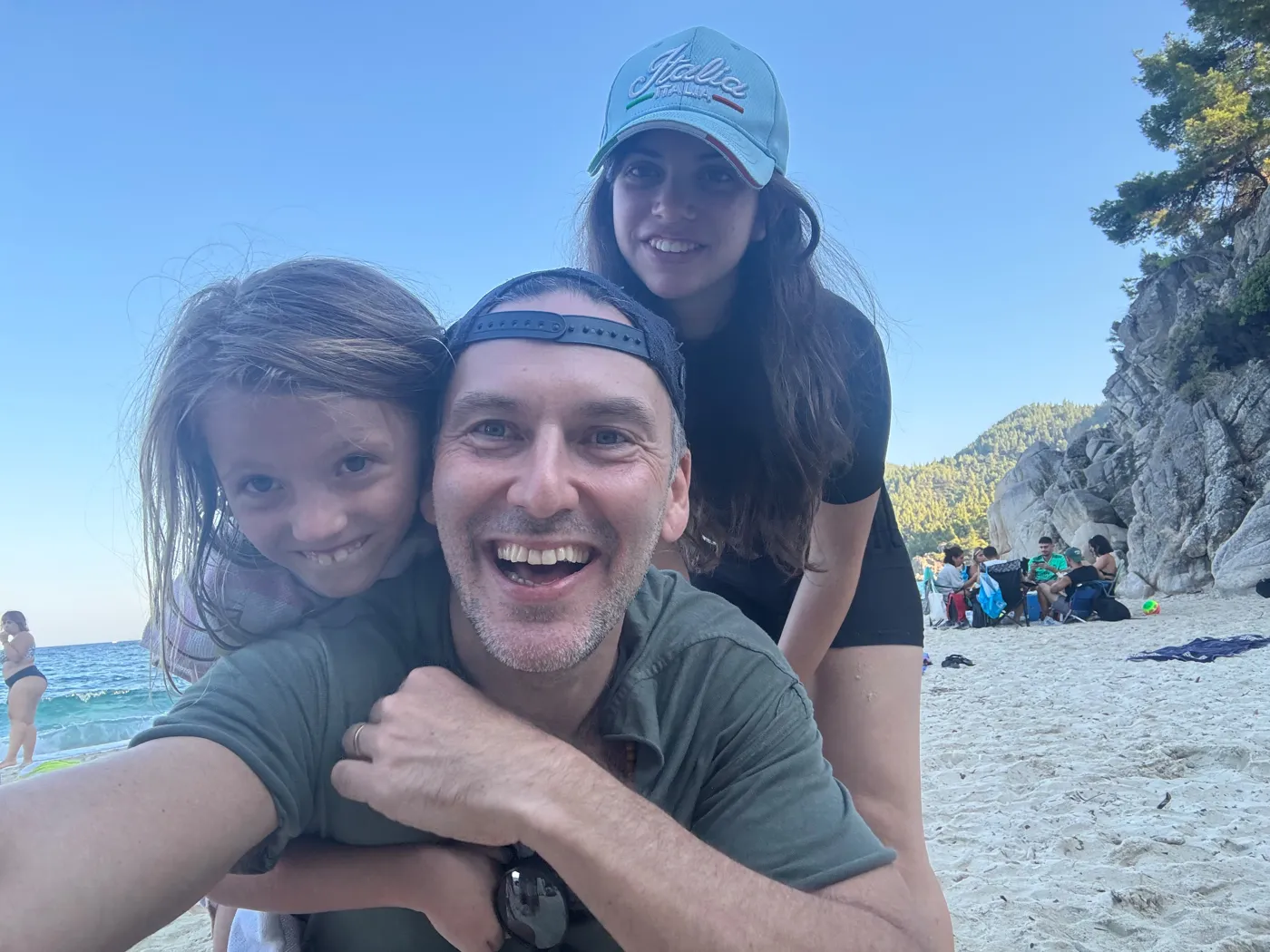 Liran Jakob Rosenfeld taking a beach selfie with family
