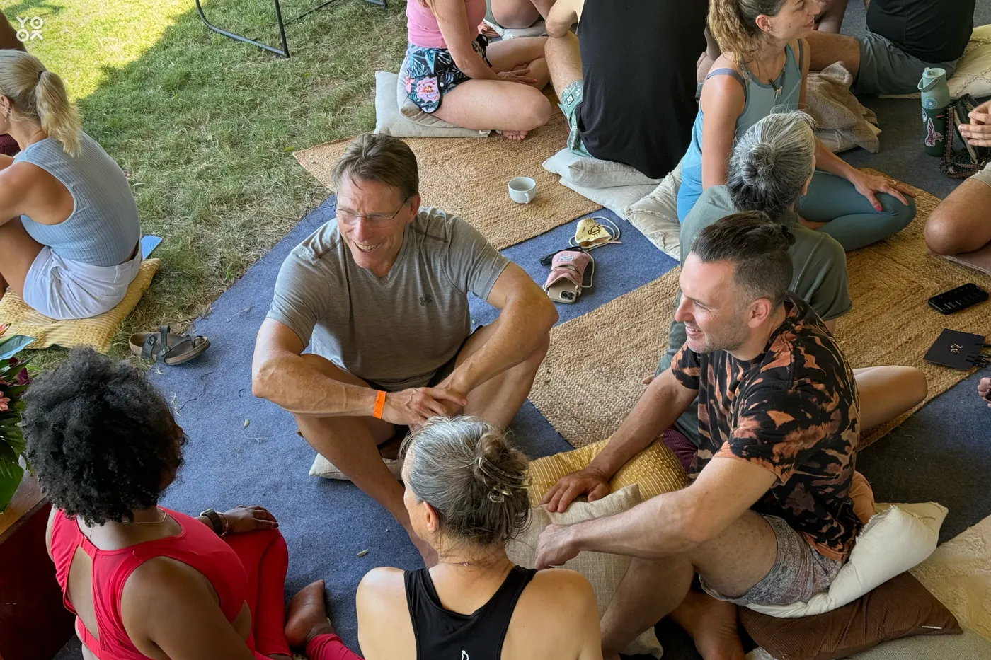 Oka community members talking together in a small Pod circle