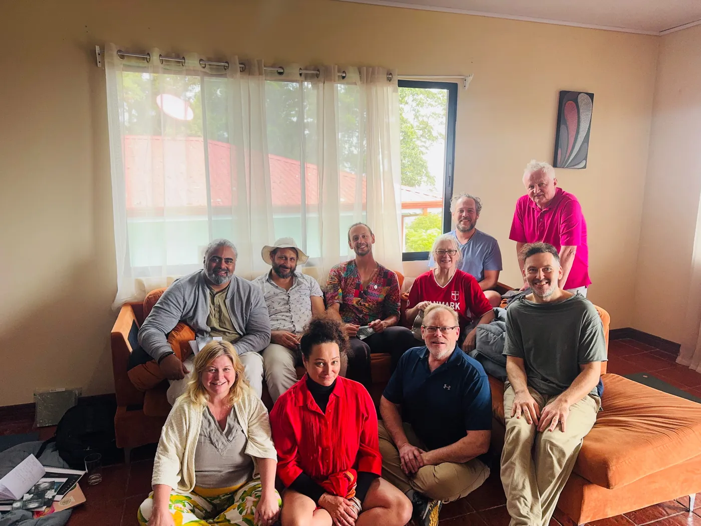 Liran Jakob Rosenfeld on a couch with friends and community
