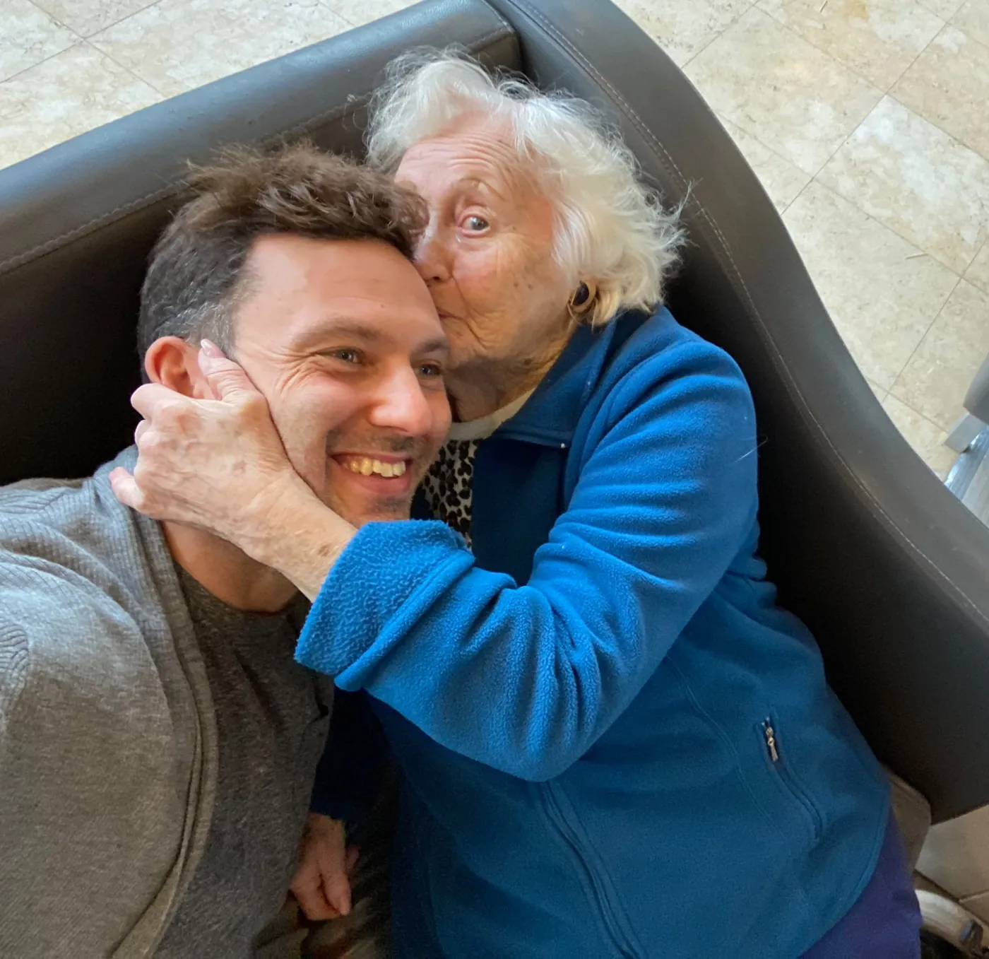 Esther Rosenfeld kissing her grandson, Liran Jakob Rosenfeld