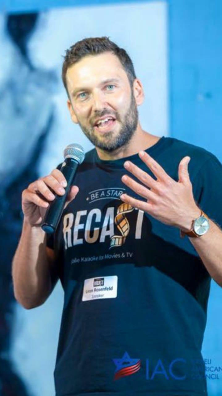 Liran Jakob Rosenfeld on stage in a Recast T-shirt